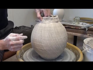 textured pot-bellied porcelain vase using liquid glue (stationery glue, or sodium silicate) and a special cutter.