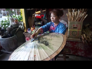 master at work - paper umbrella tung, or yuzhi san on a bamboo base (stages of creating an umbrella dome). big tits