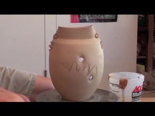 master chuen lin's potter's wheel - vase of change with porcelain inlay.