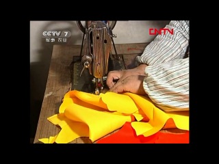 needlework - sewing a folklore teen's soft toy tiger.